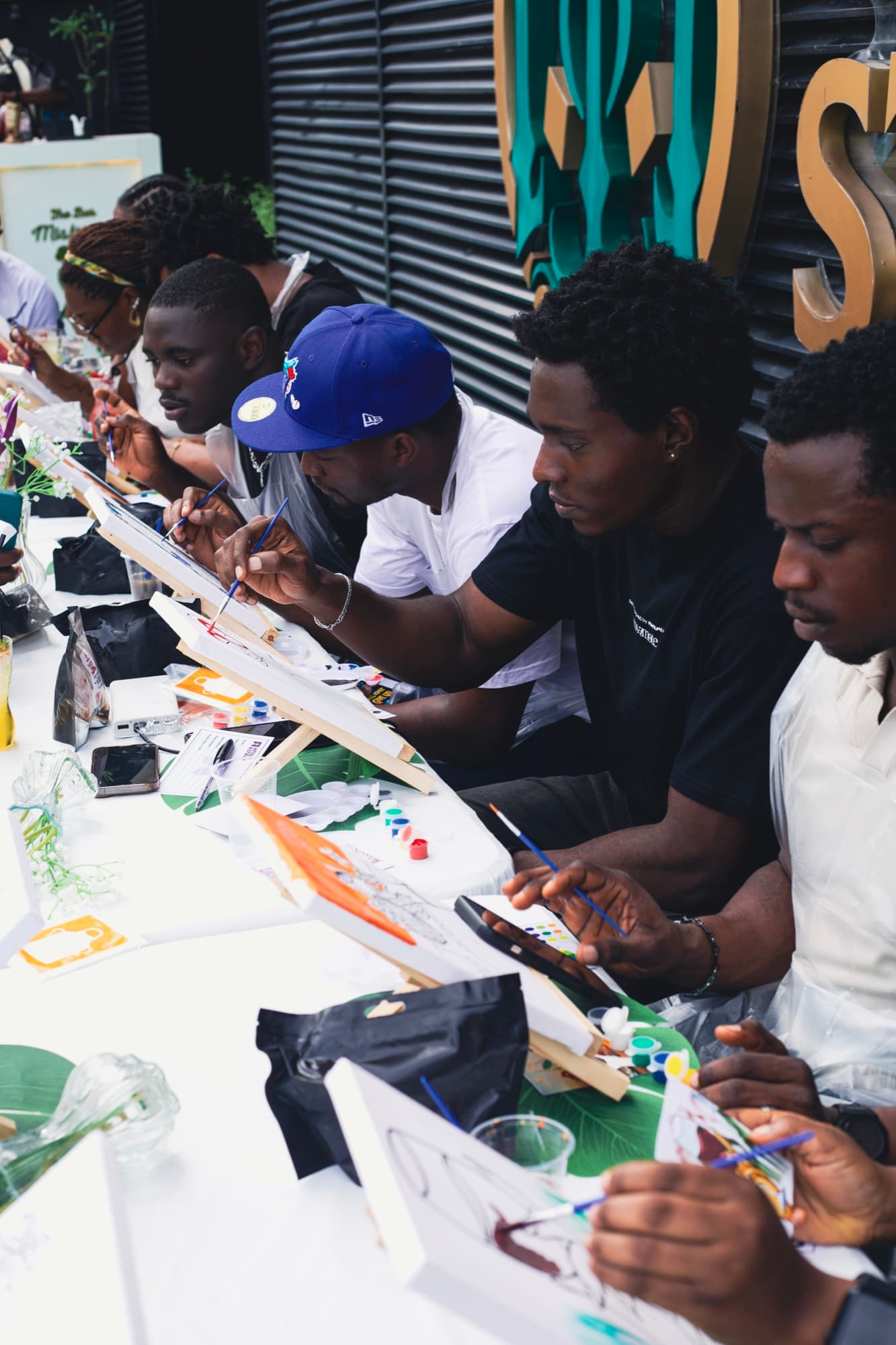 A wide view of guests painting at the Sip & Paint session.