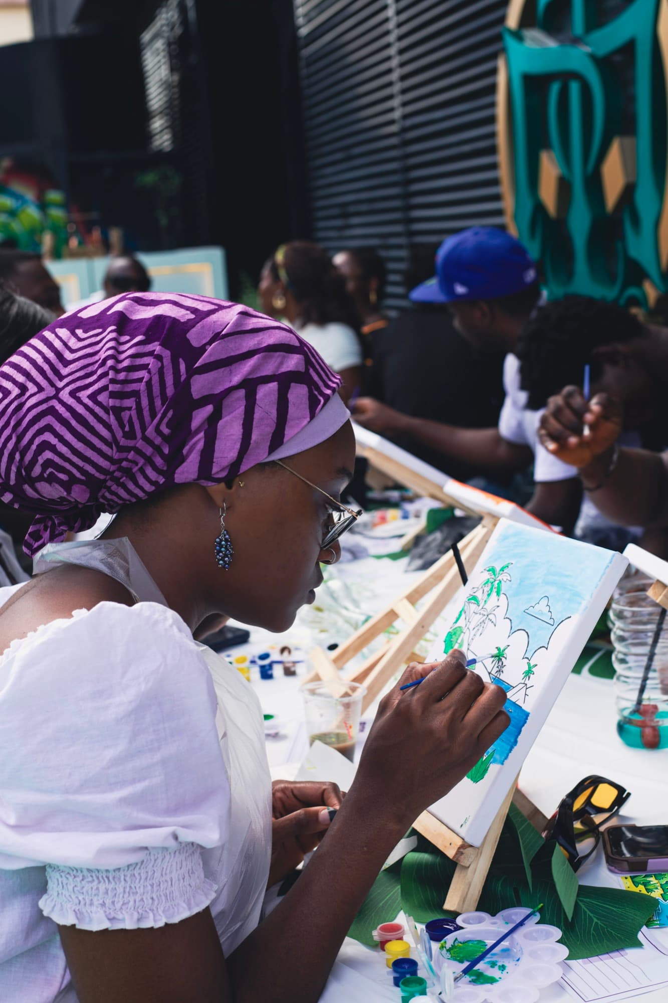 A guest painting at the Sip & Paint session.