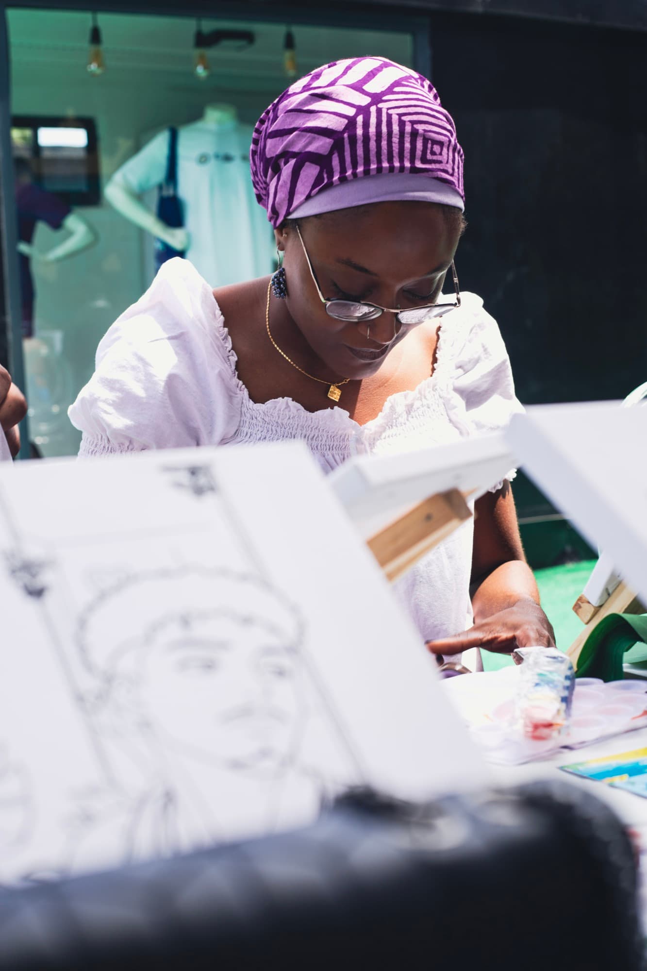 A guest painting at the Sip & Paint session.